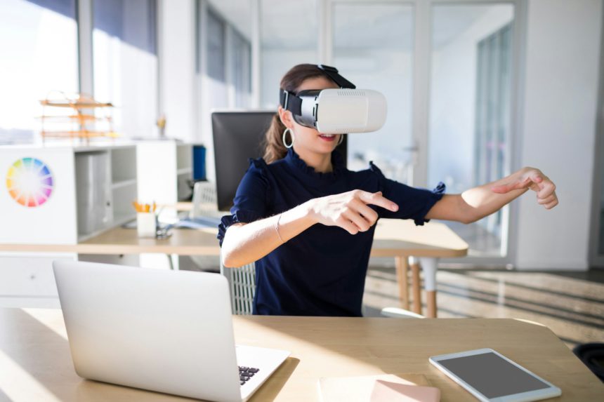 Female executive using virtual reality headset