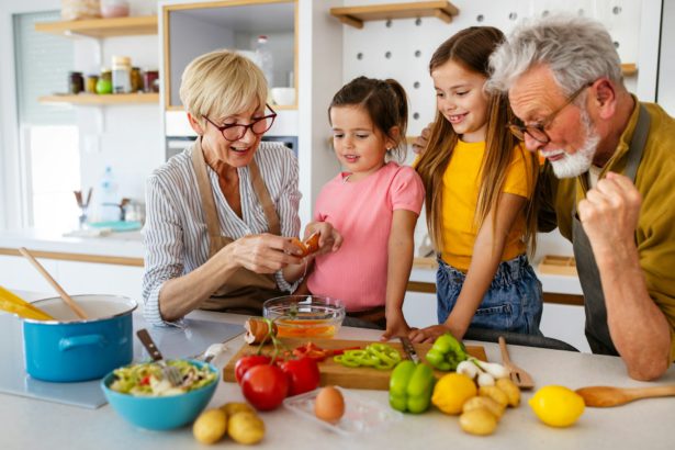 Happy grandparents having fun times with children at home